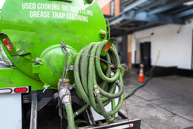 a service truck pumping grease from a restaurant's grease trap in Claremont, CA